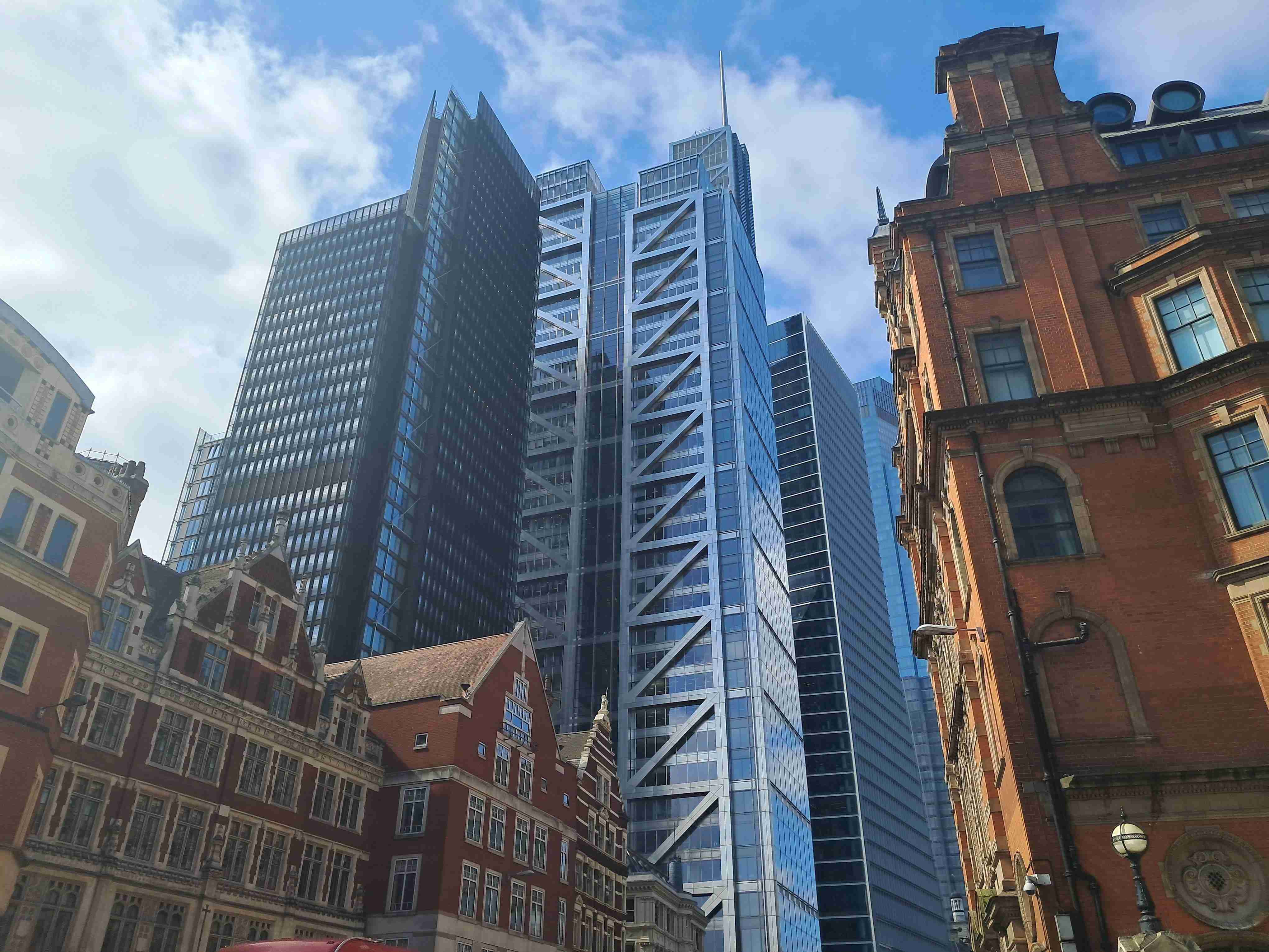 Liverpool street upwards view of a architectural style mashup.